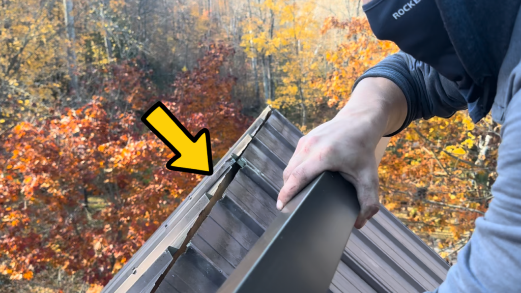 Metal roof ridge cap removed to reveal a large gap beneath the roof peak. Openings like these can allow bats to enter attic spaces.
