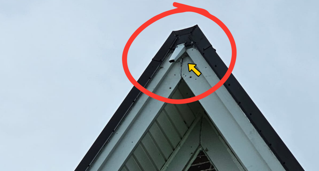 Custom aluminum bat excluder installed at the gable peak of a house for humane bat exclusion