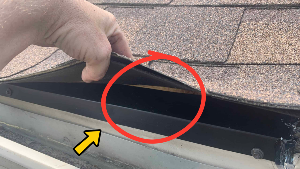 Custom-fabricated drip edge installed beneath the first row of shingles to seal a hidden roof-edge gap.