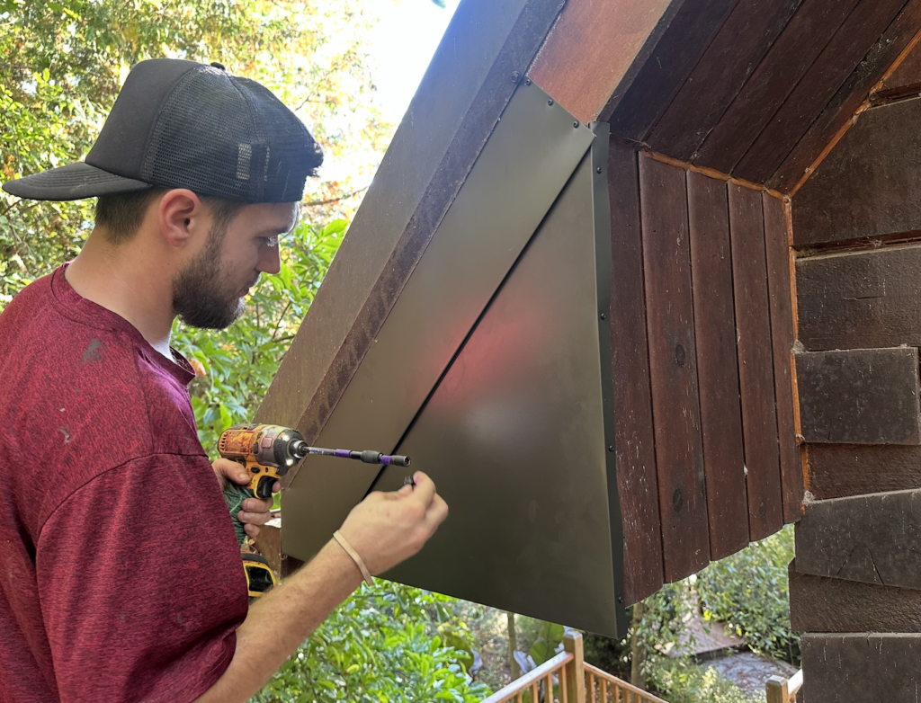 Custom metal flashing installed over rotted fascia soffit and siding to keep bats and rain out