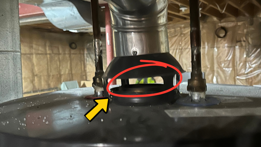 Open gap around water heater vent that can allow bats to enter the basement through the metal chimney vent