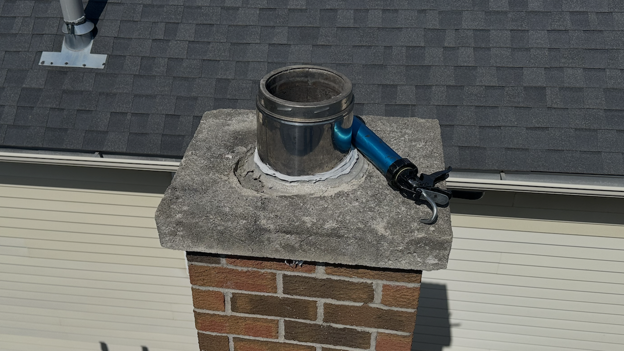 Deteriorating chimney cap with open flue that can allow bats, rats, and other animals to enter