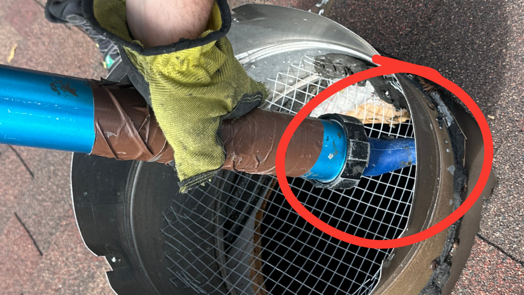 Technician sealing around half-inch screen installed inside a turbine roof vent