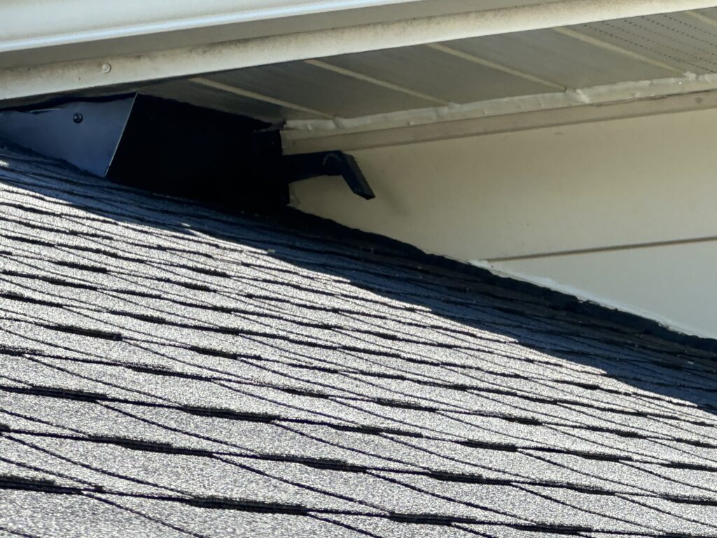 After photo of soffit and shingle intersection flashing with a bat backslider installed.